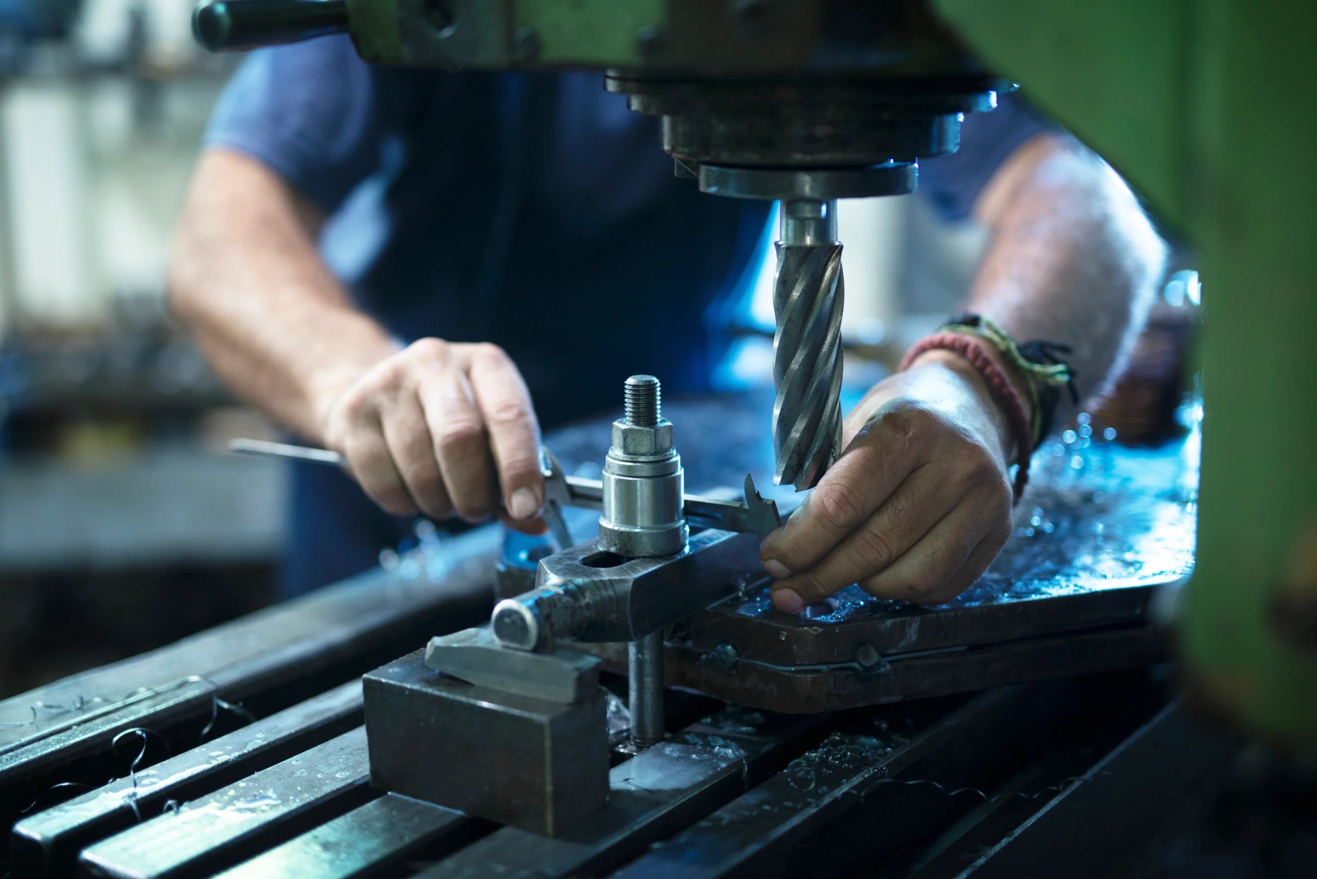 worker-operating-industrial-machine-metal-workshop